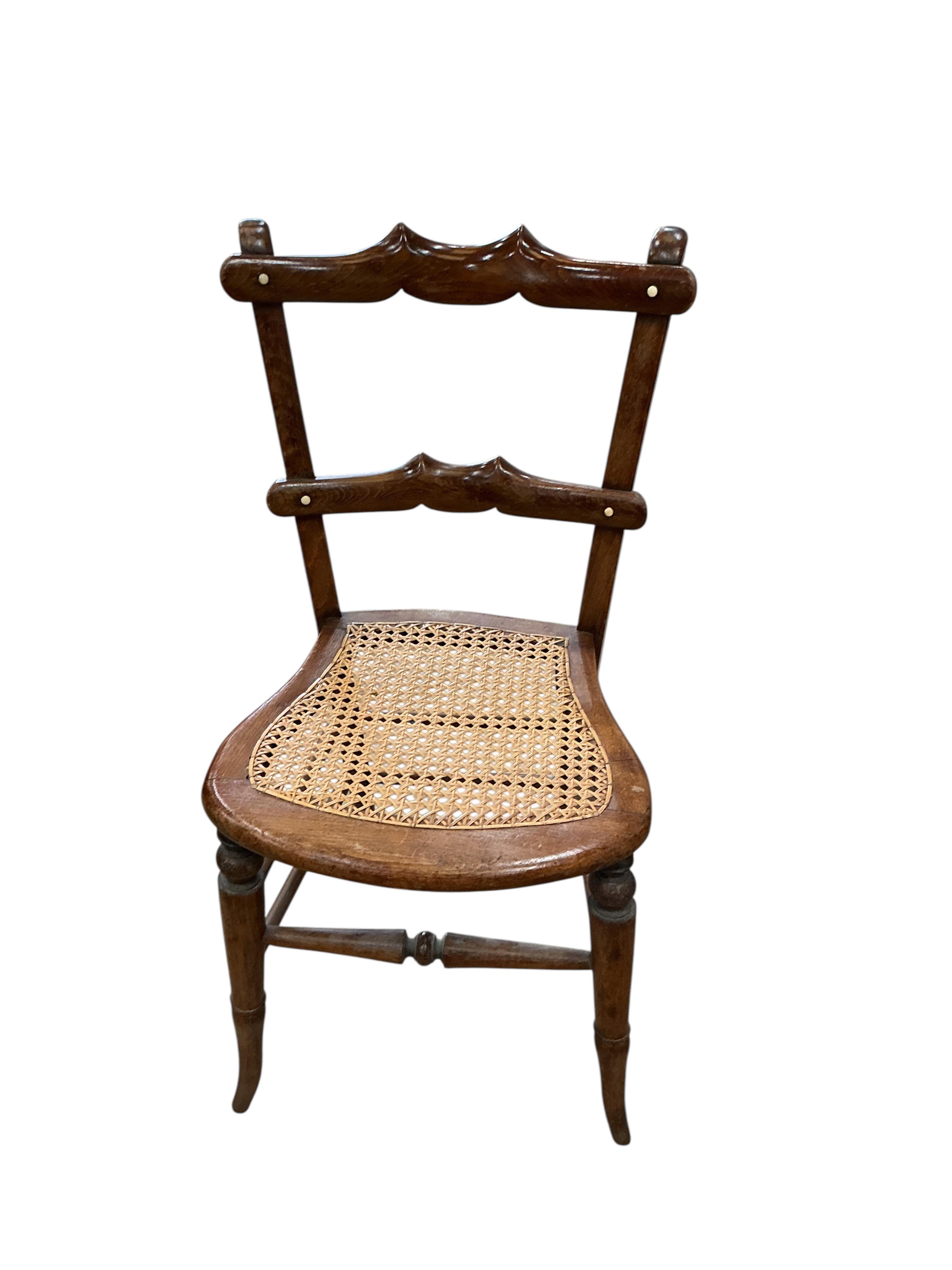 A harlequin set of six 19th century French beech cane seat chairs